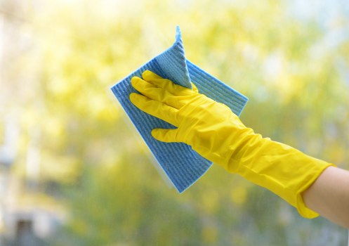 Poppy Clean team performing facade cleaning on a commercial building